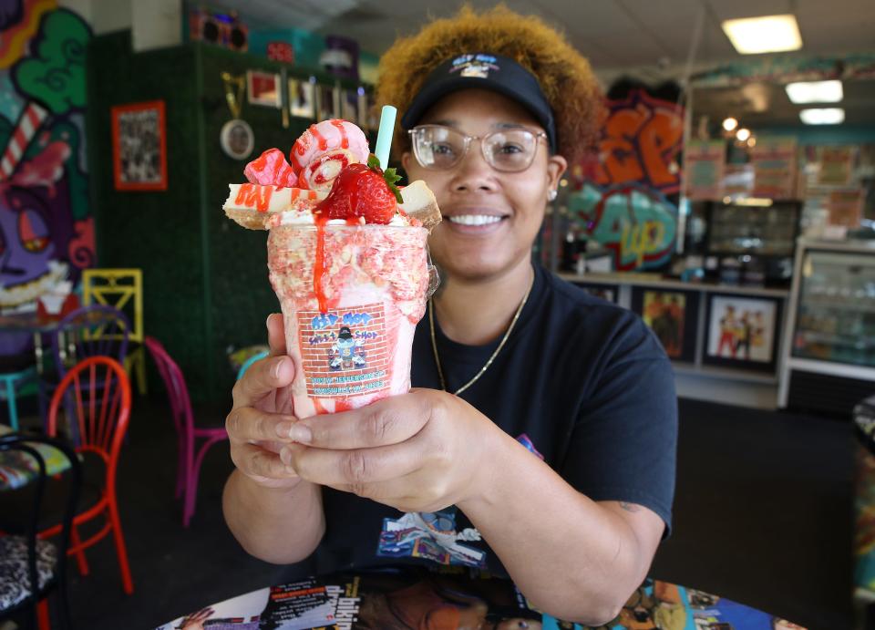 Lafesa Johnson, owner of the Hip Hop Sweet Shop, with one of her creations, a strawberry cheesecake milkshake.