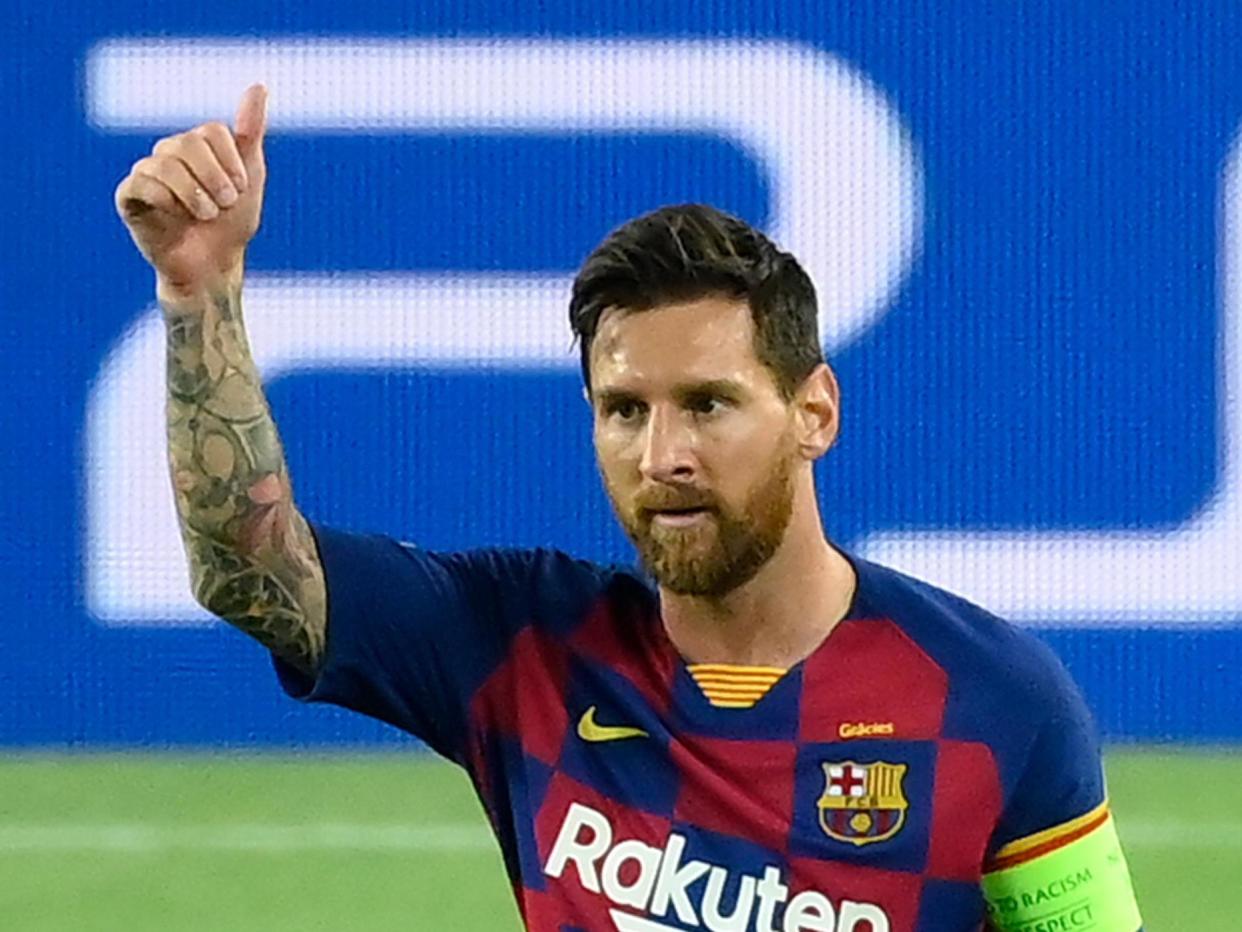 Messi celebrates scoring a double against Napoli: AFP