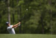 Bryson DeChambeau watches his tee shot on the 12th hole during the first round at the Masters golf tournament at Augusta National Golf Club Thursday, April 11, 2024, in Augusta, Ga. (AP Photo/Charlie Riedel)