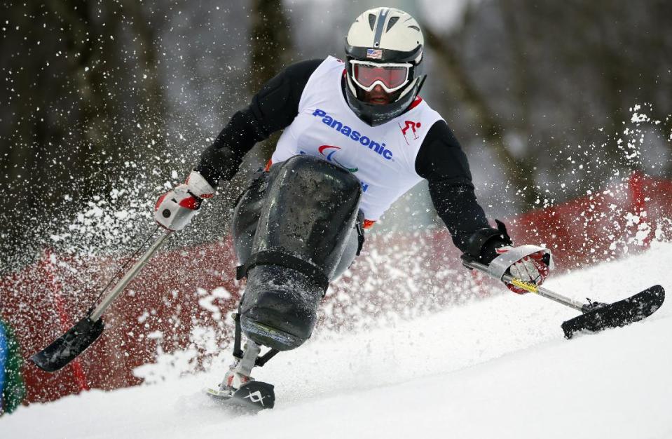 Gerald Hayden, of the United States, competes during the men's alpine skiing, slalom, sitting event at the 2014 Winter Paralympic, Thursday, March 13, 2014, in Krasnaya Polyana, Russia. (AP Photo/Dmitry Lovetsky)