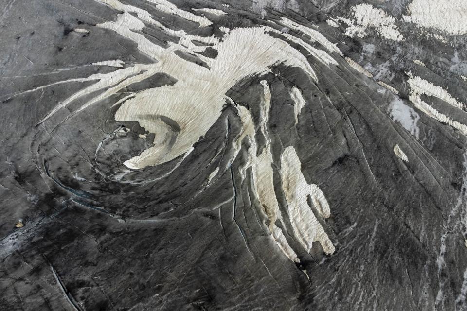 Part of the Rhone Glacier is visible near Goms, Switzerland, Thursday, June 15, 2023. (AP Photo/Matthias Schrader)