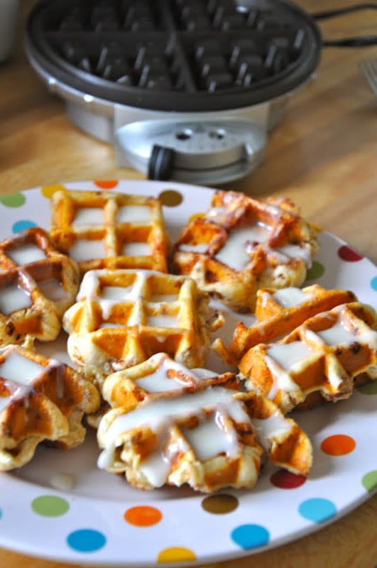 <p>Little Bit Funky</p><p>Skip the hard work of making cinnamon rolls, letting them rise and baking them. Follow this recipe for the taste and deliciousness of Cinnamon Roll Mini Waffles with a delicious cream cheese glaze!</p><p><strong>Get The Recipe: <a href="http://www.littlebitfunky.com/2012/03/cinnamon-rolls-in-waffle-iron-who-knew.html" rel="nofollow noopener" target="_blank" data-ylk="slk:Cinnamon Roll Mini Waffles;elm:context_link;itc:0;sec:content-canvas" class="link ">Cinnamon Roll Mini Waffles</a></strong></p>