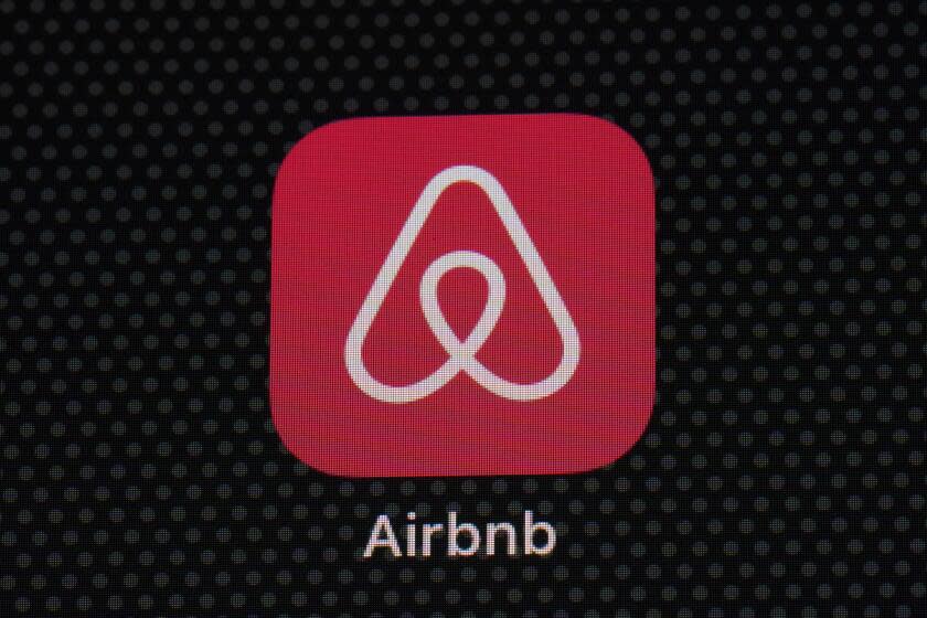 FILE - The Airbnb app icon is seen on an iPad screen, Saturday, May 8, 2021, in Washington. Thousands of Airbnb hosts have agreed to house refugees as part of the online lodging marketplace's philanthropic program to provide emergency temporary housing to those who need it. (AP Photo/Patrick Semansky, File)