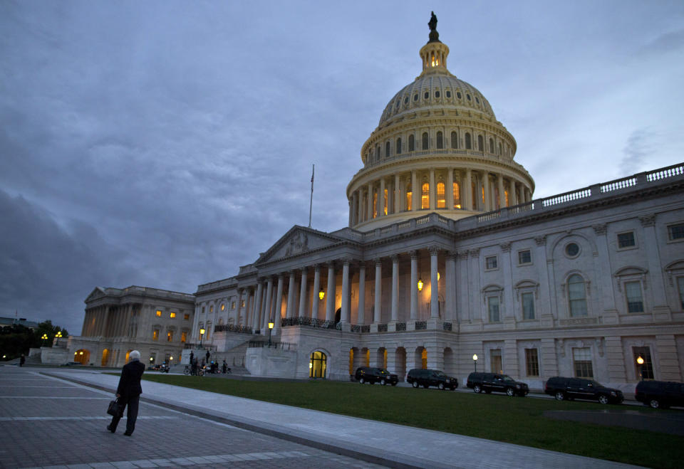 A view of the U.S. Capitol building on Tuesday, Oct. 15, 2013 in Washington. The partial government shutdown is in its third week and less than two days before the Treasury Department says it will be unable to borrow and will rely on a cash cushion to pay the country's bills. (AP Photo/ Evan Vucci)