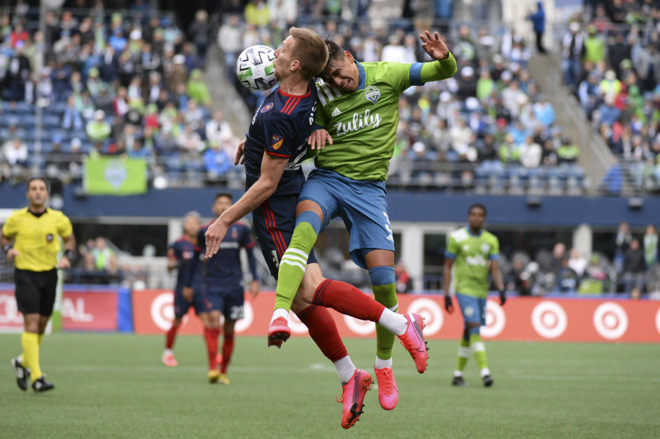 SEATTLE, WA - MARCH 01: Chicago Fire Robert Beric (27) and Zavier Arreaga (3) go up for a header during a MLS match between the Chicago Fire and the Seattle Sounders at Century Link Field in Seattle, WA. (Photo by Jeff Halstead/Icon Sportswire via Getty Images)