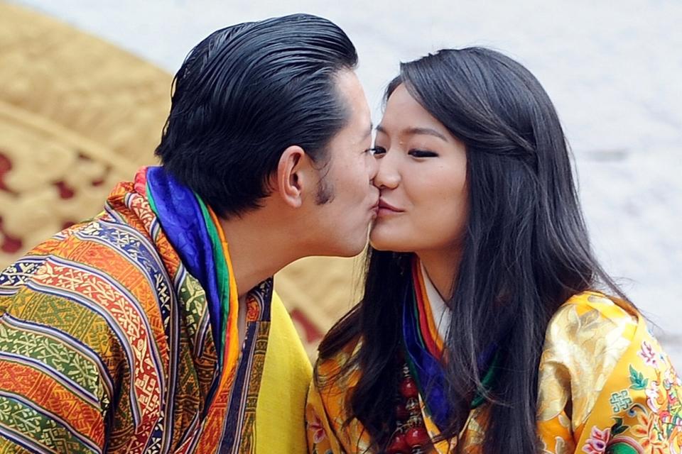 His majesty King Jigme Khesar Namgyel Wangchuck, 31, and Queen Jetsun Pema, 21, walk out after their marriage ceremony is completed on October 13, 2011 in Punakha, Bhutan.
