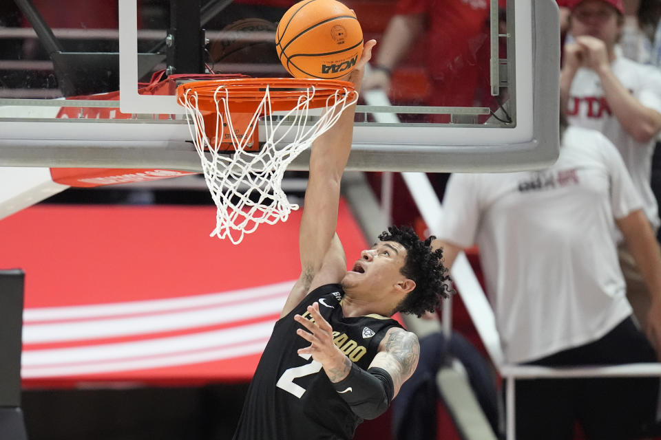 Colorado guard KJ Simpson dunks against Utah during the second half of an NCAA college basketball game Saturday, Feb. 3, 2024, in Salt Lake City. (AP Photo/Rick Bowmer)