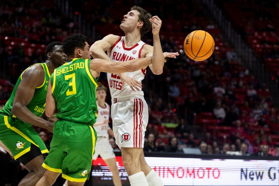 Utah Utes guard Luka Tarlac (21) is blocked by Oregon Ducks guard Jackson Shelstad (3) and center N’Faly Dante (1) at the Huntsman Center in Salt Lake City on Jan. 21, 2024. | Marielle Scott, Deseret News