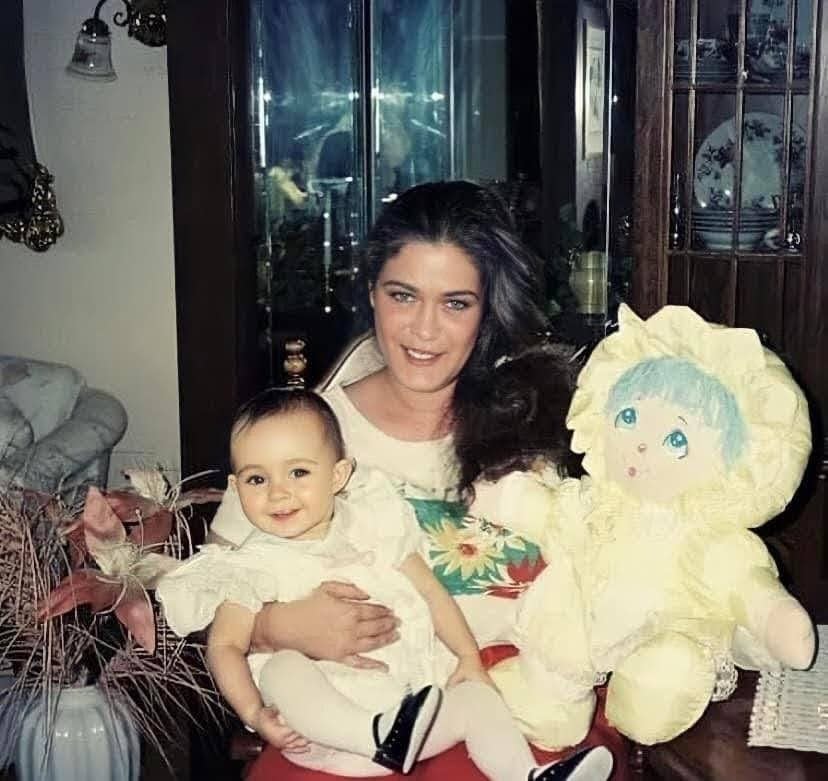 Lori Lee (Malloy) Mariano holds her daughter, Lauren, on Christmas Day 1992. Several months later, Lori would be found dead in her East Providence home.