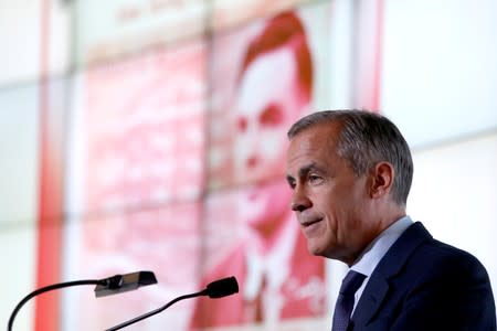 Bank of England governor Mark Carney presents the image of mathematician Alan Turing who will appear on a new 50 pound note at the Science and Industry Museum in Manchester