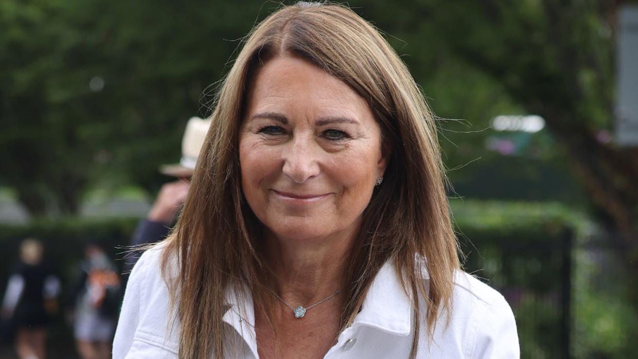 Carole Middleton wearing white jacket and floral jumpsuit