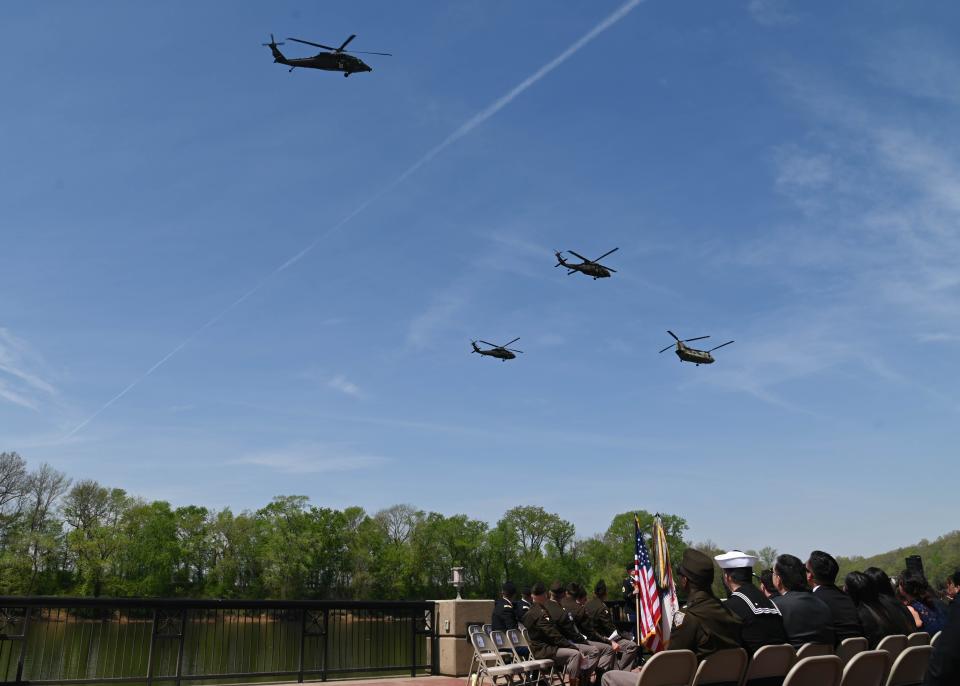 Soldiers of the 101st Combat Aviation Brigade, 101st Airborne Division (Air Assault) perform a missing man formation flyover during a posthumous award and promotion ceremony at Clarksville, Tenn., April 13, 2023. The ceremony was held to honor the nine Soldiers from Charlie Company, 6th Battalion, 101st Aviation Regiment, 101st Combat Aviation Brigade, killed in a helicopter accident March 29.