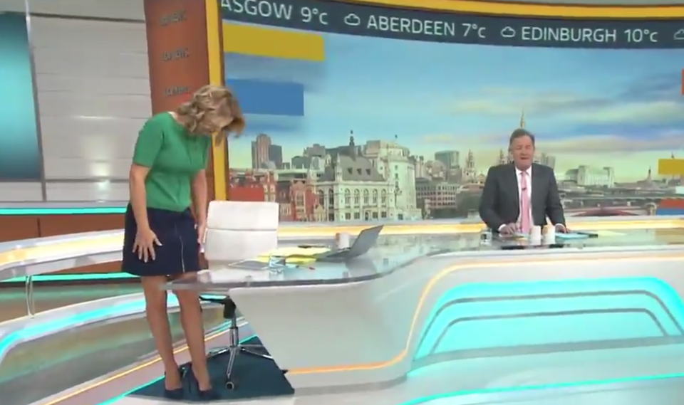 Charlotte Hawkins stands up as Piers Morgan watches on during the Good Morning Britain program. 