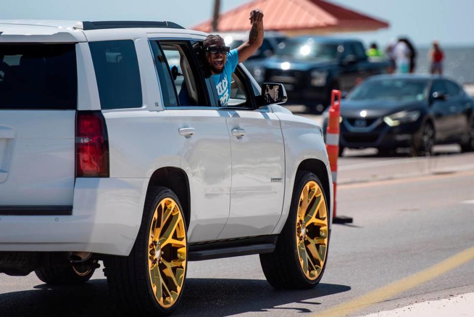 A spring breakers yells from a car during Black Spring Break in Biloxi on Saturday, April 13, 2024