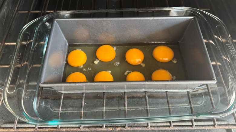 raw eggs in pan in oven