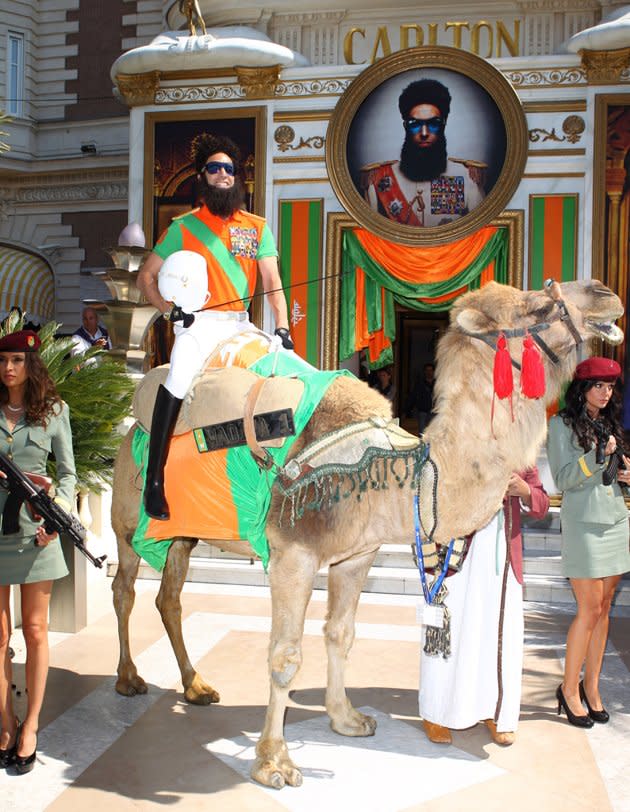 Not content to just make a splash at sea, Cohen as Aladeen arrived at the festival on camel. He was accompanied by two leggy, gun-toting models to the Carlton Hotel, which was given a Dictator-style makeover for the event. Cohen's wife, Isla Fisher, who was at Cannes to promote her animated movie "Rise of the Guardians," was overheard by The Hollywood Reporter saying, "I don't know how the camel is going to fit in there."