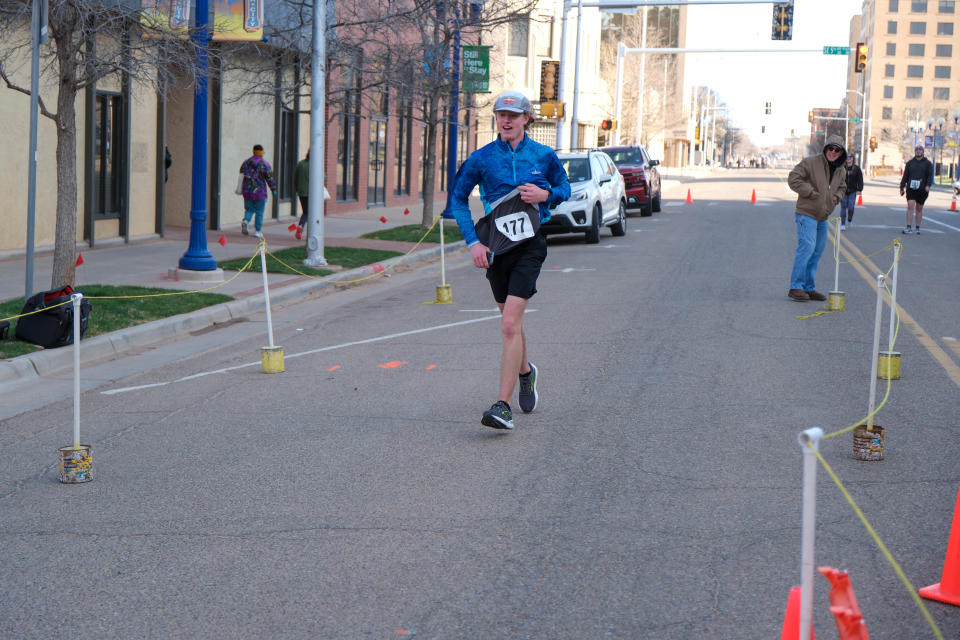 Jason Knapp, winner of the 10K, approaches the finish line Saturday in the 2023 Center City Mural Run in downtown Amarillo.