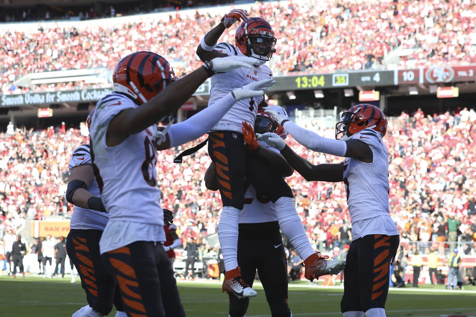 Cincinnati Bengals wide receiver Ja'Marr Chase, top middle, is congratulated by teammates after scoring against the San Francisco 49ers during the second half of an NFL football game in Santa Clara, Calif., Sunday, Oct. 29, 2023. (AP Photo/Jed Jacobsohn)