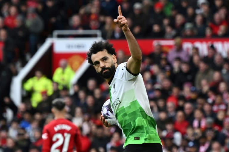 <a class="link " href="https://sports.yahoo.com/soccer/players/3862743/" data-i13n="sec:content-canvas;subsec:anchor_text;elm:context_link" data-ylk="slk:Mohamed Salah;sec:content-canvas;subsec:anchor_text;elm:context_link;itc:0">Mohamed Salah</a>'s penalty earned <a class="link " href="https://sports.yahoo.com/soccer/teams/liverpool/" data-i13n="sec:content-canvas;subsec:anchor_text;elm:context_link" data-ylk="slk:Liverpool;sec:content-canvas;subsec:anchor_text;elm:context_link;itc:0">Liverpool</a> a 2-2 draw at <a class="link " href="https://sports.yahoo.com/soccer/teams/man-utd/" data-i13n="sec:content-canvas;subsec:anchor_text;elm:context_link" data-ylk="slk:Manchester United;sec:content-canvas;subsec:anchor_text;elm:context_link;itc:0">Manchester United</a> (Paul ELLIS)