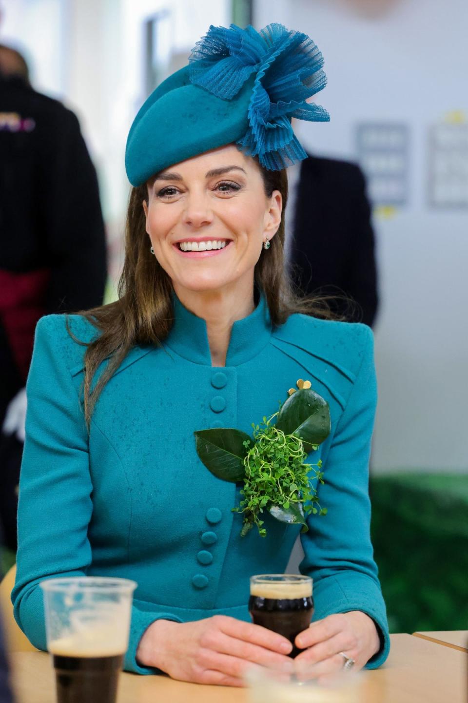 The Princess of Wales meets members of the Irish Guards and enjoys a glass of Guinness during a visit to the 1st Battalion Irish Guards for the St Patrick's Day Parade, at Mons Barracks in Aldershot (PA)