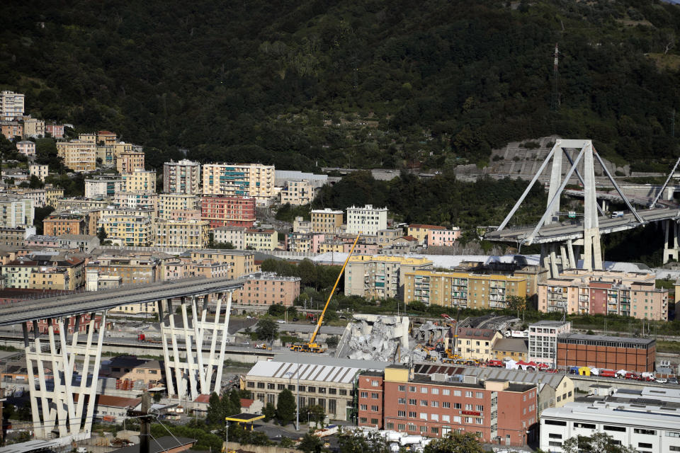 FILE - A view of the collapsed Morandi highway bridge in Genoa, Italy, Friday, Aug. 17, 2018. On Monday, Aug. 14, 2023, Italy marked the fifth anniversary of the collapse of Genoa’s Morandi Bridge with a minute of silence and demands for justice for the 43 people killed in what authorities say was an example of greed-fueled negligence. (AP Photo/Gregorio Borgia, File)
