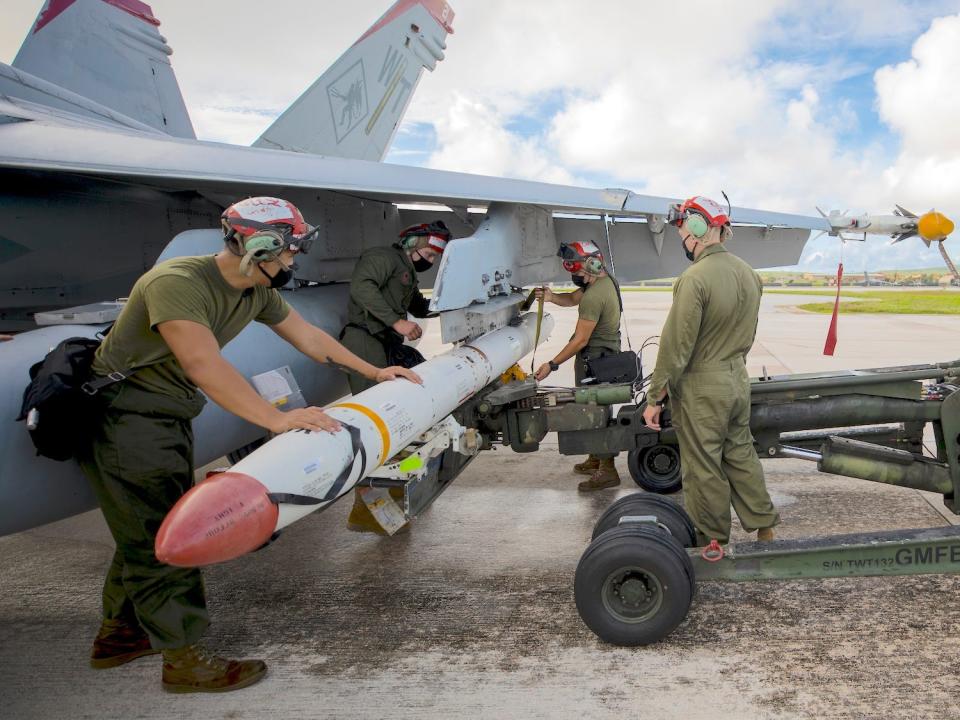 Marines load AGM-88 High Speed Anti-Radiation Missile on F/A-18C