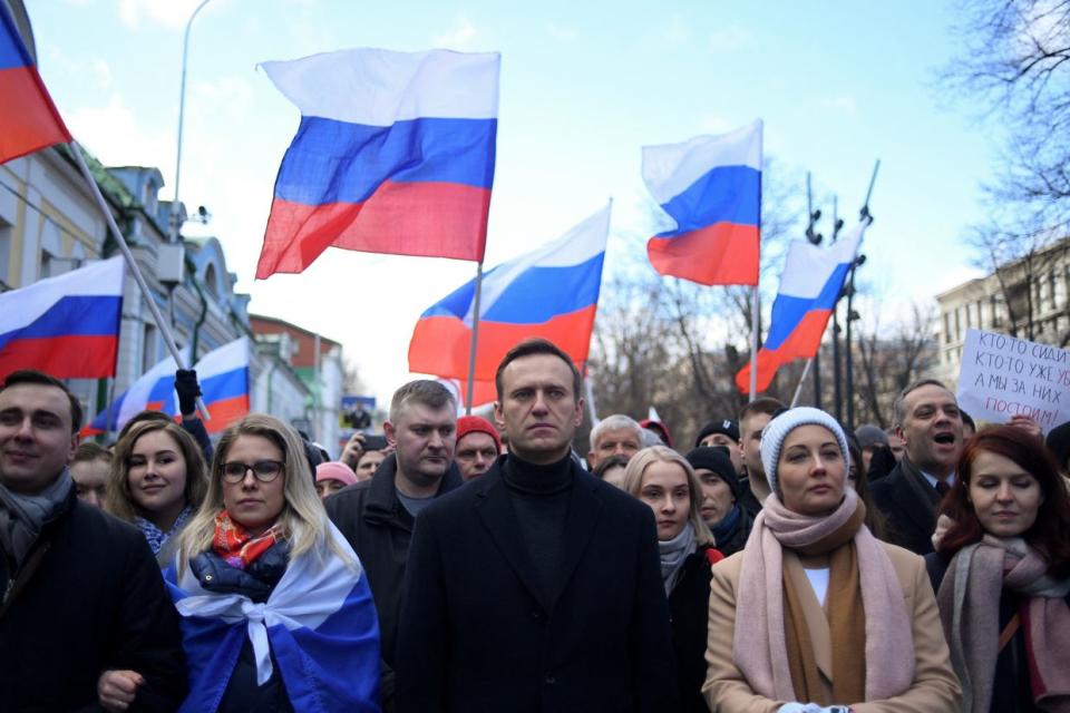 TOPSHOT - Russian opposition leader Alexei Navalny, his wife Yulia, opposition politician Lyubov Sobol and other demonstrators march in memory of murdered Kremlin critic Boris Nemtsov in downtown Moscow on February 29, 2020. (Kirill Kudryavtsev/AFP via Getty Images)