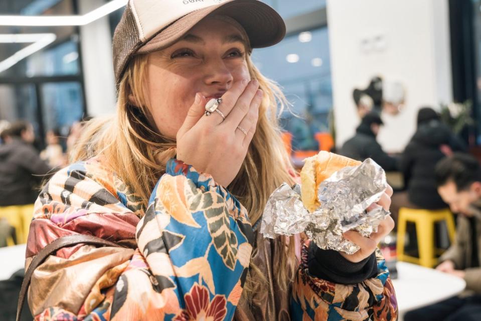 Customer Calli Ferguson enjoys a burger and a tuna melt sandwich. Stefano Giovannini