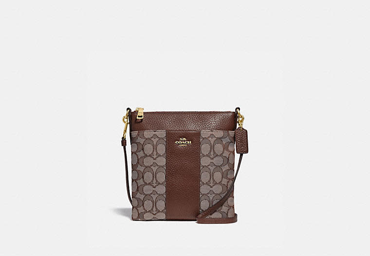 Kitt Messenger Crossbody In Signature Jacquard. Image via Coach.