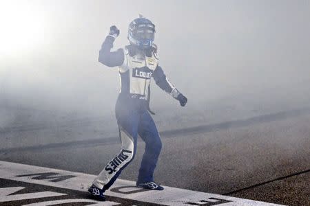 Nov 20, 2016; Homestead, FL, USA; NASCAR Sprint Cup Series driver Jimmie Johnson (48) celebrates after winning the NASCAR Sprint Cup Championship after the Ford Ecoboost 400 at Homestead-Miami Speedway. Mandatory Credit: Jasen Vinlove-USA TODAY Sports