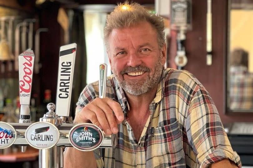 Martin behind the bar before the pub was taken 'back to brick' for the renovation to begin