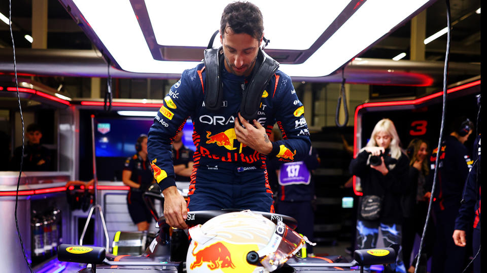 Daniel Ricciardo climbs into the 2023 Red Bull.