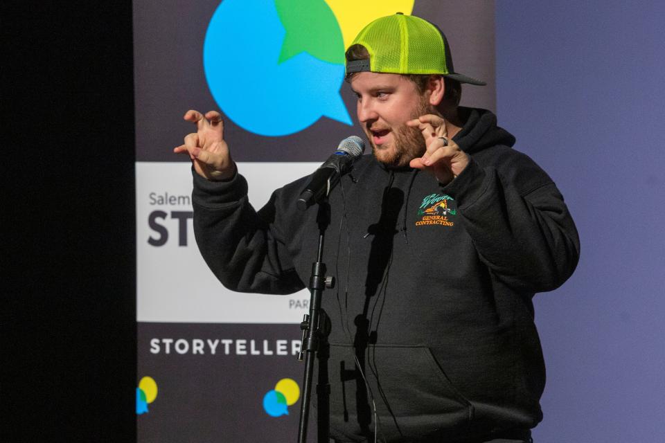 Kris Brown tells a story about a turbulent hiking trip during the "It Seemed Like A Good Idea At The Time" show for the Salem Storytellers Project at Salem's Historic Grand Theatre on Nov. 13.