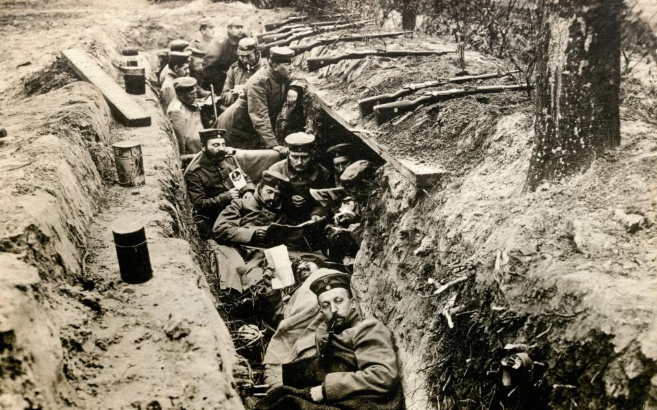 Outgunned and exhausted: German infantry resting during a lull in battle - Bettmann