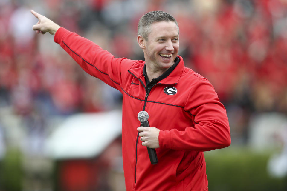 FILE - Georgia head basketball coach Mike White on the field before Georgia's spring NCAA college football game on April 16, 2022, in Athens, Ga. (AP Photo/Brett Davis, File)