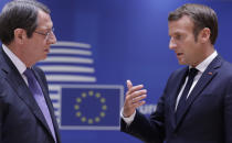 French President Emmanuel Macron, right, speaks with Cypriot President Nicos Anastasiades during a round table meeting at an EU summit at the European Council building in Brussels, Thursday, Oct. 1, 2020. European Union leaders are meeting to address a series of foreign affairs issues ranging from Belarus to Turkey and tensions in the eastern Mediterranean. (Olivier Hoslet, Pool via AP)