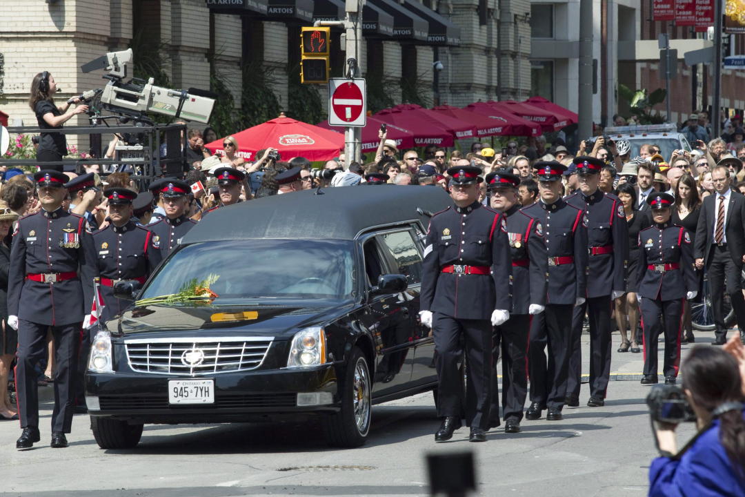 The funeral procession for the late NDP leader Jack Layton, arrives at Roy Thomson Hall, in Toronto on Saturday, August 27, 2011. THE CANADIAN PRESS/Chris Young