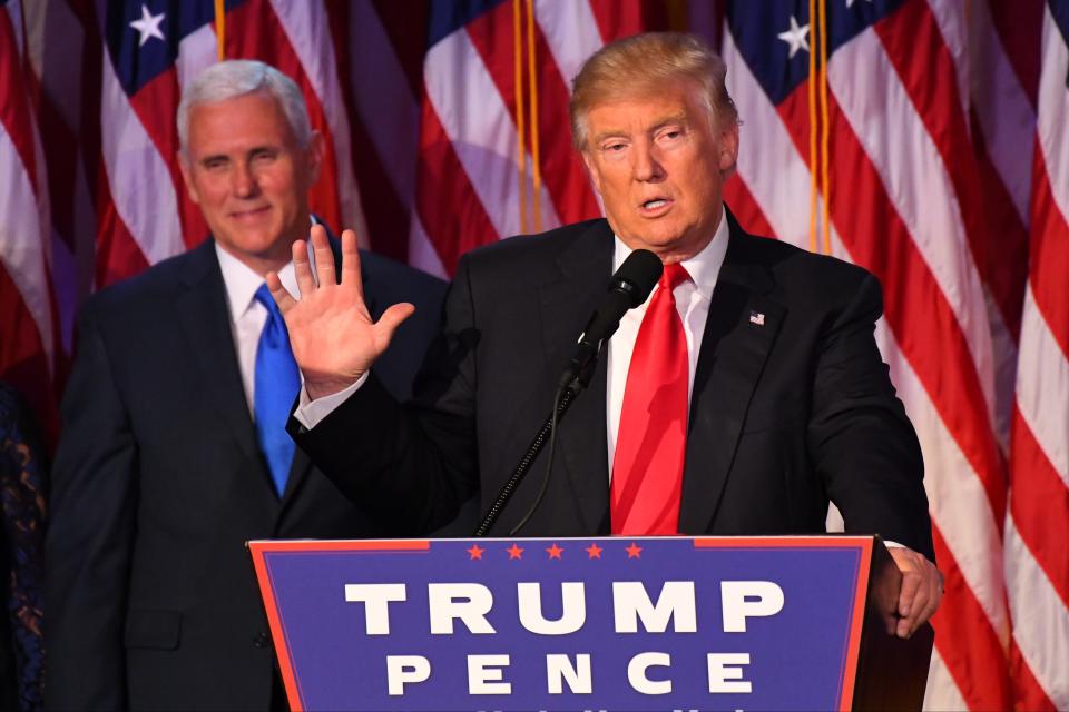 President-elect Donald Trump addresses supporters in New York on Nov. 9, 2016, as Vice President-elect Mike Pence looks on.