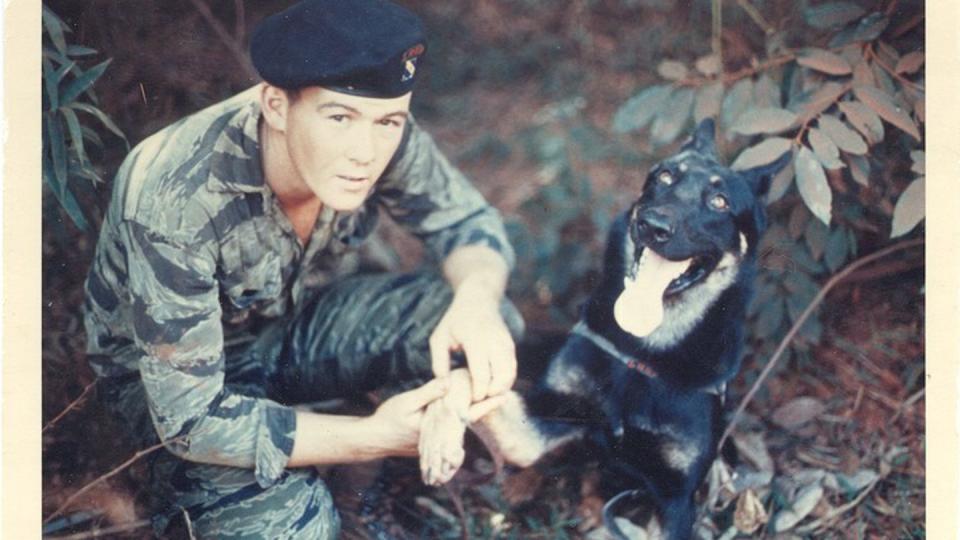 Sgt. David Hill and his military working dog 