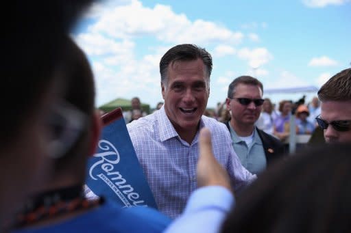 Republican Presidential candidate, former Massachusetts Governor Mitt Romney greets people during a campaign event at Scamman Farm in Stratham, New Hampshire. Romney kicked off a six-state bus tour Friday across what he called the "backbone of America," as he seeks to cast himself as more in touch with struggling voters than President Barack Obama