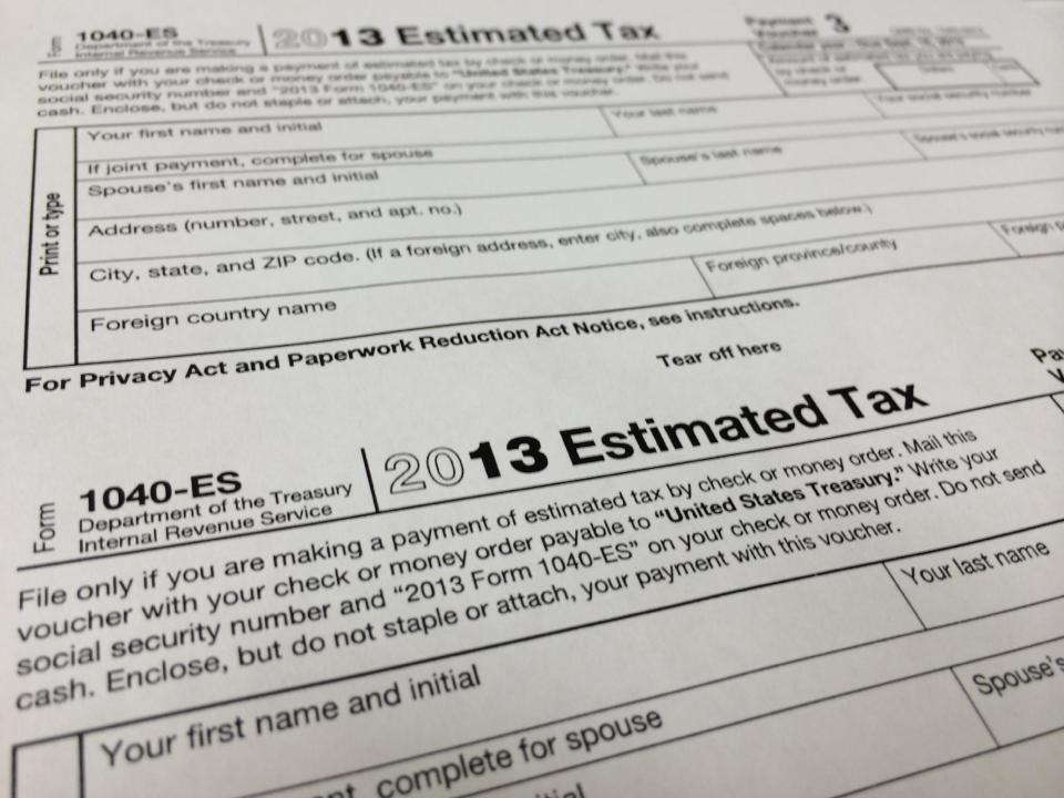 This Thursday, Jan. 9, 2013 photo, shows a 2013 1040-ES IRS Estimated Tax form at H & R Block tax preparation office in the Echo Park district of Los Angeles. “The United States income tax is a pay-as-you-go tax, which means that tax must be paid as you earn or receive your income during the year,” the IRS says. “You can either do this through withholding or by making estimated tax payments.” (AP Photo/Damian Dovarganes)
