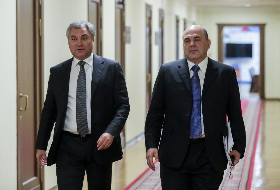 In this photo provided by The State Duma, The Federal Assembly of The Russian Federation, Russian State Duma speaker Vyacheslav Volodin, left, and Russian Tax Service chief Mikhail Mishustin, who was nominated to replace Medvedev, walk in the State Duma, the Lower House of the Russian Parliament in Moscow, Russia, Thursday, Jan. 16, 2020. Russian President Vladimir Putin has named tax service chief Mikhail Mishustin as Russia's new prime minister. (The State Duma, The Federal Assembly of The Russian Federation via AP)