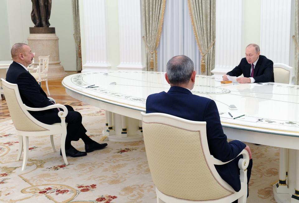 Russian President Vladimir Putin, right, speaks during his meeting with Azerbaijan's President Ilham Aliyev, left, and Armenian Prime Minister Nikol Pashinyan in Kremlin in Moscow, Russia, Monday, Jan. 11, 2021. Russian President Vladimir Putin on Monday hosted his counterparts from Armenia and Azerbaijan, their first meeting since a Russia-brokered truce ended six weeks of fighting over Nagorno-Karabakh. (Mikhail Klimentyev, Sputnik, Kremlin Pool Photo via AP)