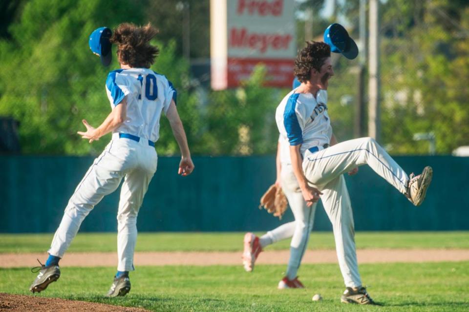 Stadium first baseman Logan Judish (10) and third baseman Tristan Luxenberg (9) celebrate the Tigers’ win over Gig Harbor in the opening round of the Class 3A state baseball playoffs on Tuesday, May 16, 2023 at Heidelberg Sports Complex in Tacoma, Wash.