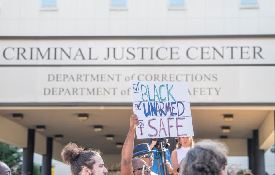 Families and activist gather to protest the Alabama Department of Corrections outside the Alabama Criminal Justice Center in Montgomery, Ala., on Monday, Sept. 26, 2022.