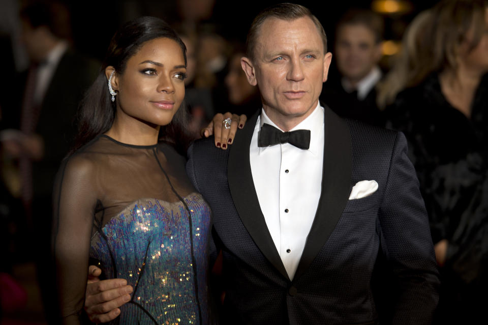 British actors Daniel Craig (R) and Naomie Harris (L) pose together as they arrive to attend the royal world premiere of the new James Bond film 'Skyfall' at the Royal Albert Hall in London on October 23, 2012. AFP PHOTO / LEON NEAL        (Photo credit should read LEON NEAL/AFP via Getty Images)