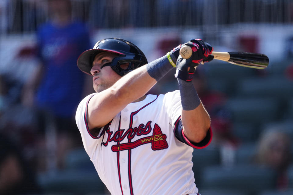 Atlanta Braves' Austin Riley hits a two-run home run in the eighth inning of a baseball game against the Arizona Diamondbacks Sunday, April 7, 2024, in Atlanta. (AP Photo/John Bazemore)