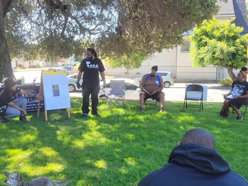 Sanyika Bryant teaching a political education class last year during Black August.