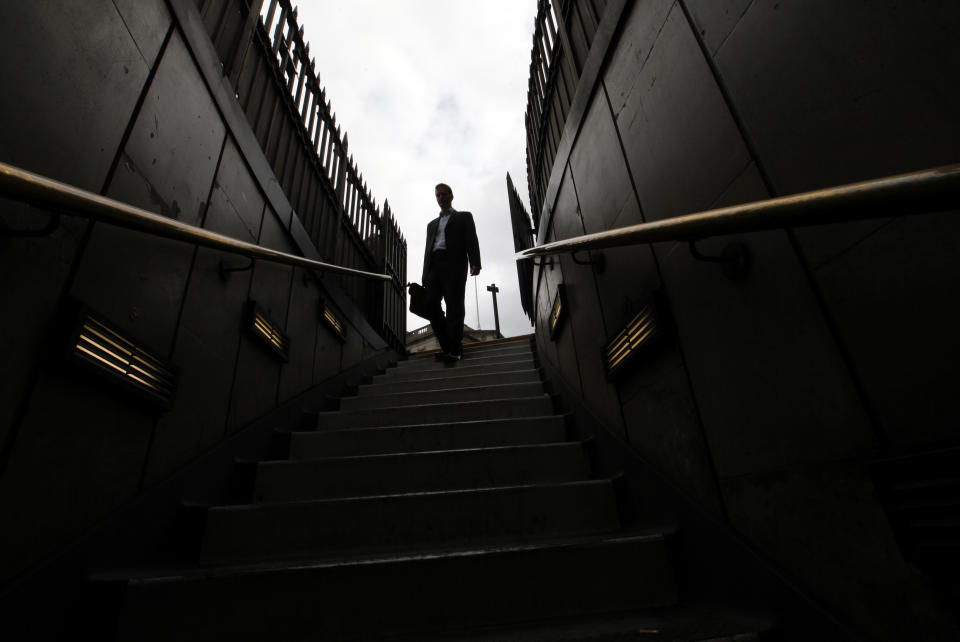 Business confidence: A man walks down steps into Bank tube station in the City of London