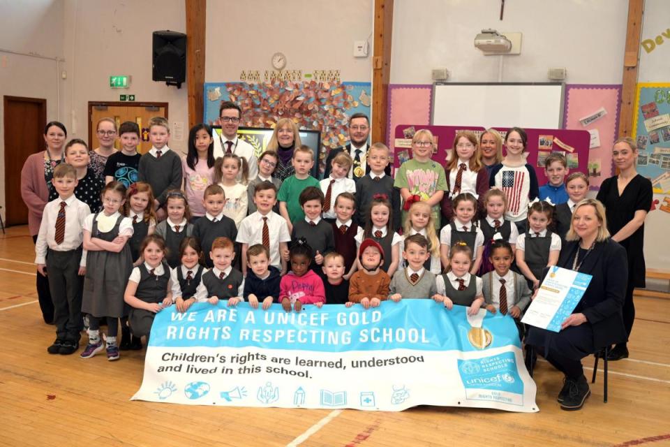 Children and staff at Holy Cross Primary celebrate winning the award. <i>(Image: North Lanarkshire Council)</i>